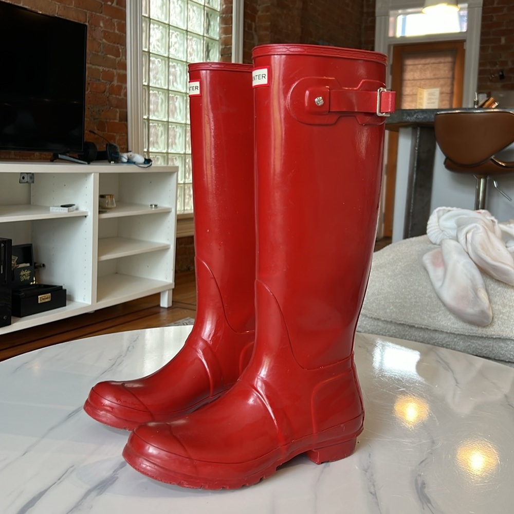 Slightly used, red shiney Hunter boots.